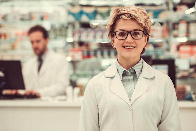 Beautiful pharmacists working in pharmacy.