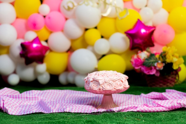 Beautiful pink cake decorated with flowers made of cheese polish