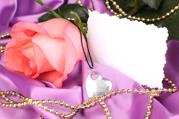 Beautiful pink rose with heart pendant