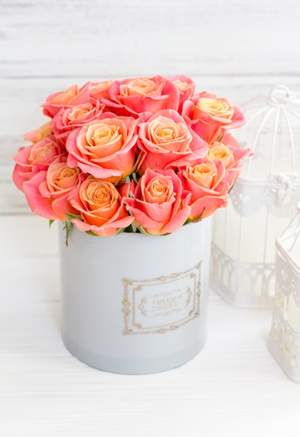 Beautiful pink roses in a round box. Peach roses in a round box. Roses in a round box 