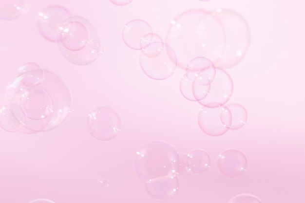 beautiful pink soap bubbles floating in the air.