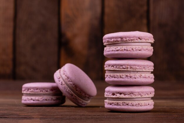 Beautiful pink tasty macaroons on a wooden background