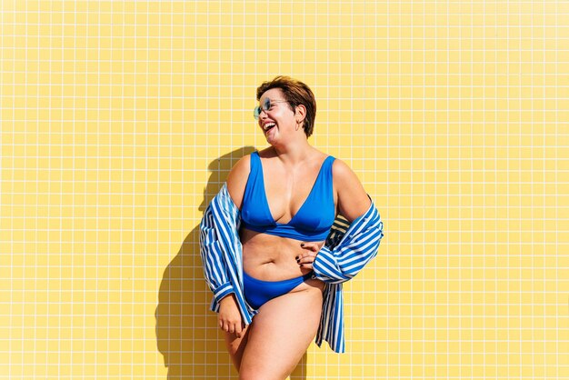 Beautiful plus size woman with swimwear at the beach