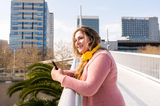 Beautiful plus size young woman outdoors