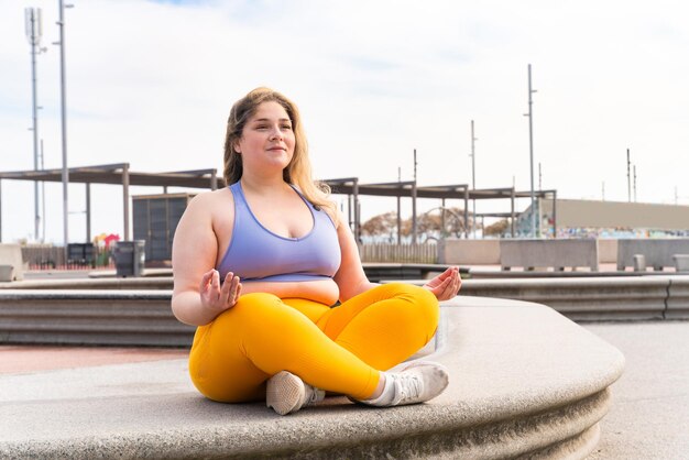 Beautiful plus size young woman outdoors