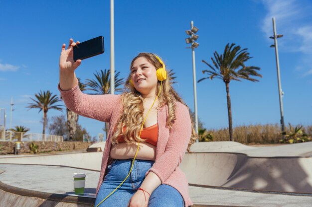 Beautiful plus size young woman outdoors