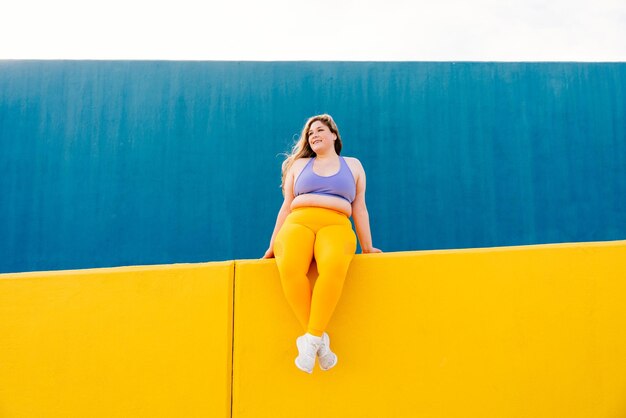 Beautiful plus size young woman outdoors