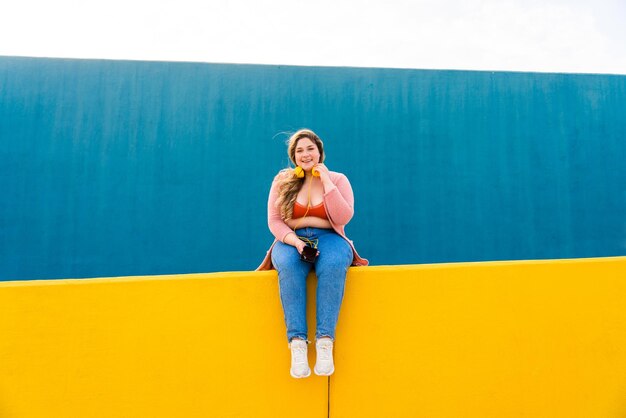 Beautiful plus size young woman outdoors