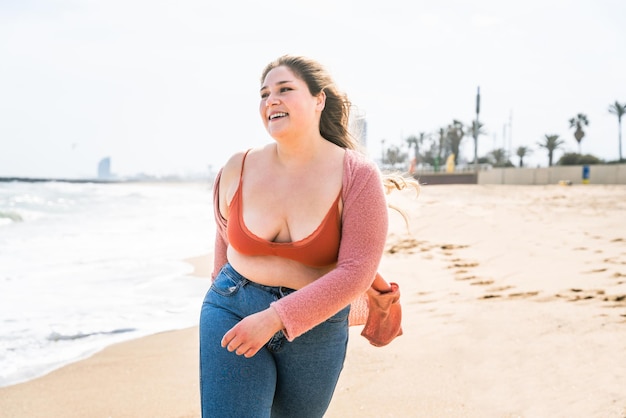 Beautiful plus size young woman outdoors