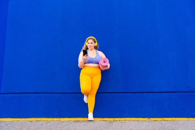 Beautiful plus size young woman outdoors