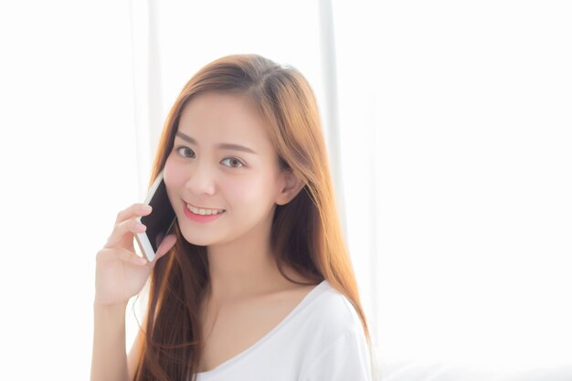 Beautiful of portrait asian woman talking smart mobile phone