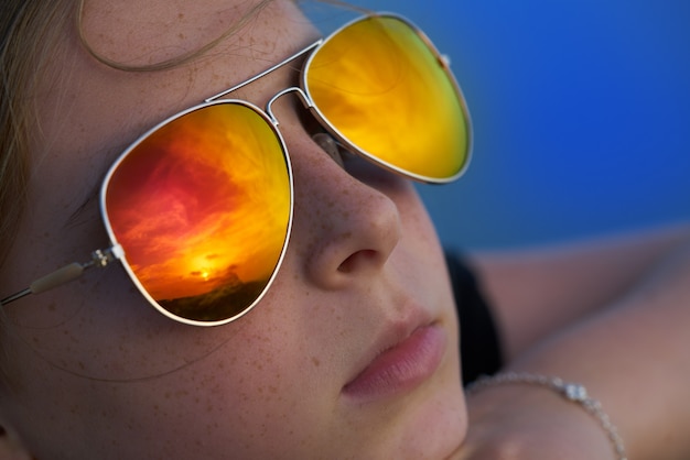 beautiful  portrait blond girl looking sunset