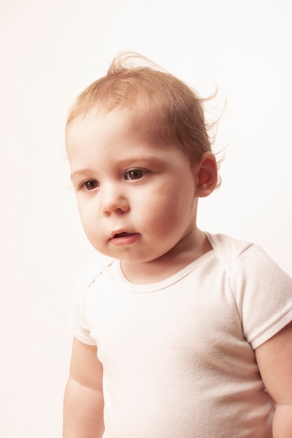 Beautiful portrait of caucasian baby on white background