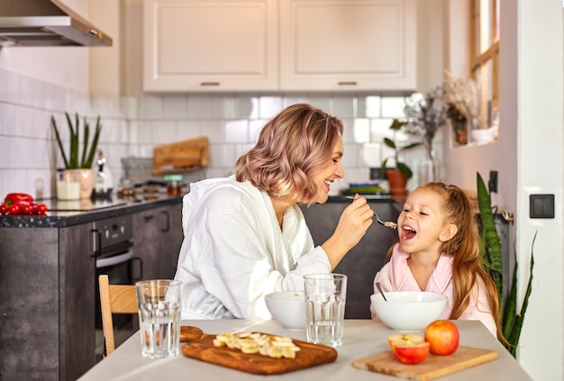 Beautiful portrait of mother and daughter spending time together