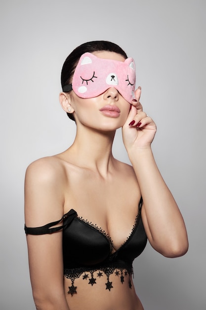 Beautiful portrait of woman with a sleep mask