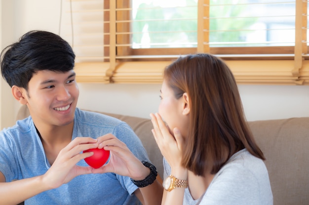 Beautiful portrait young asian couple gesture holding heart shape together