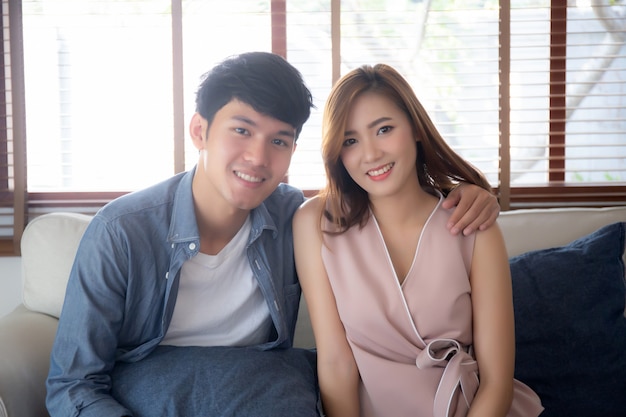Beautiful portrait young asian couple relax and satisfied together