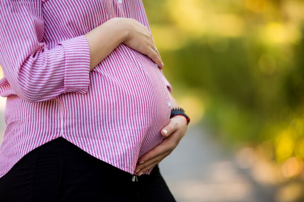 beautiful pregnant girl on a summer walk