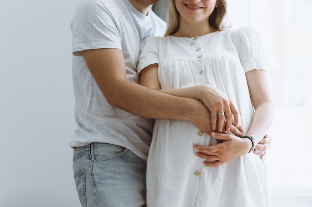 Beautiful pregnant woman and her handsome husband