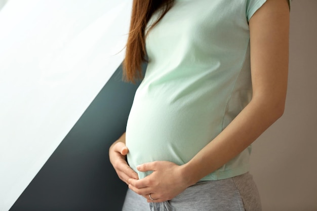 Beautiful pregnant woman at home