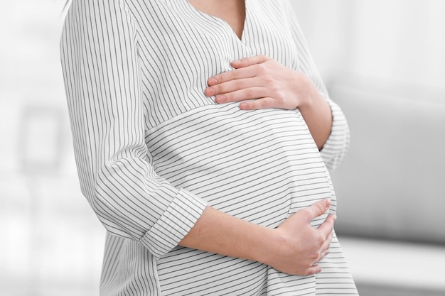 Beautiful pregnant woman resting at home