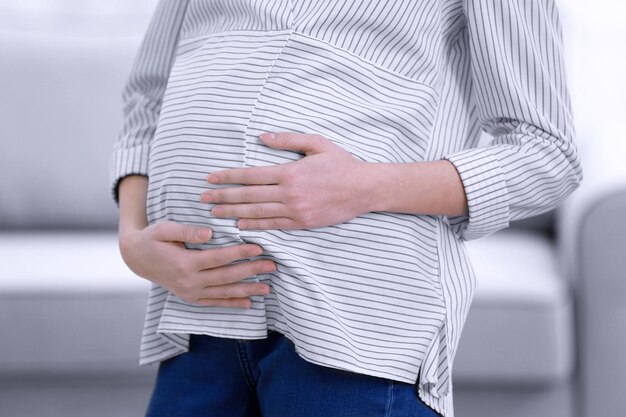 Beautiful pregnant woman resting at home