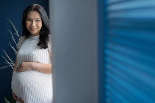 beautiful pregnant women, mother holding baby in pregnant belly