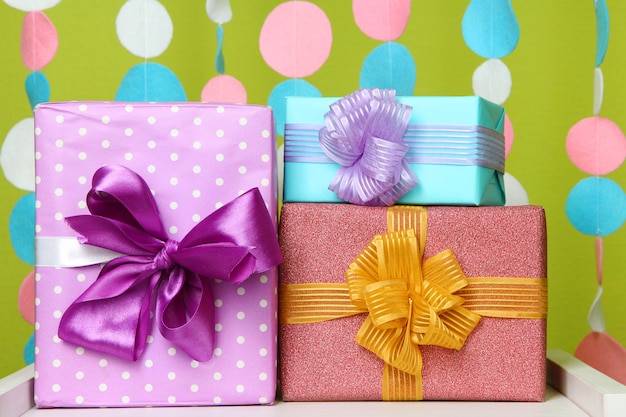 Beautiful presents on table on bright background