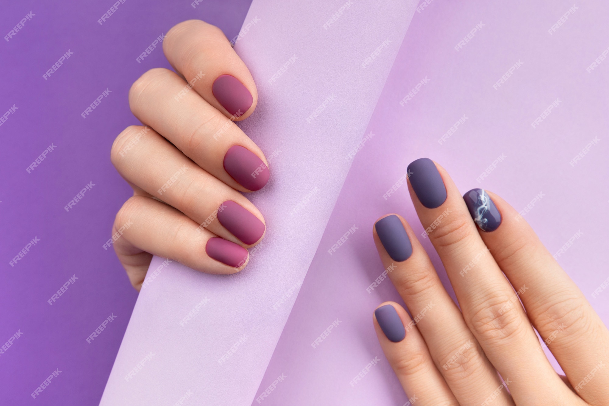 Premium Photo | Beautiful purple burgundy matte manicure on creative