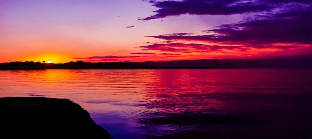 A beautiful purple sunset in a panoramic beautiful coastal landscape