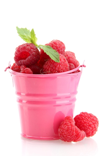Beautiful raspberries in bucket isolated on white