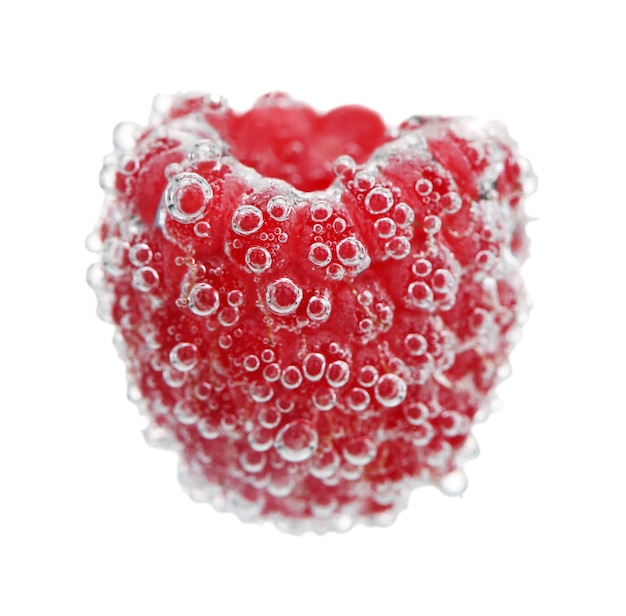 Beautiful raspberry in water with bubbles isolated on white