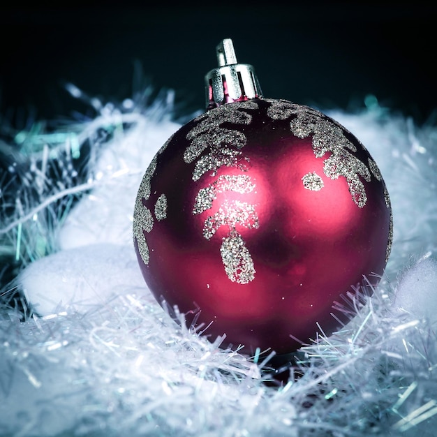 Beautiful red Christmas ball on a black background