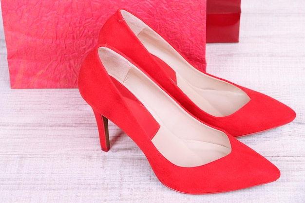 Beautiful red female shoes and shop bags