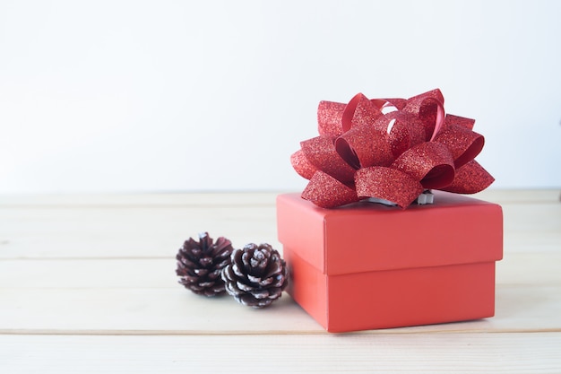 Beautiful red gift box on wooden table, Holiday gift, Valentine's Day concept