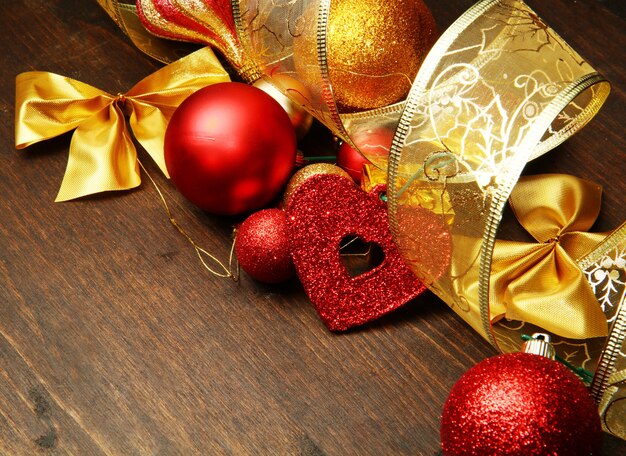 Beautiful red and gold christmas decoration on wood