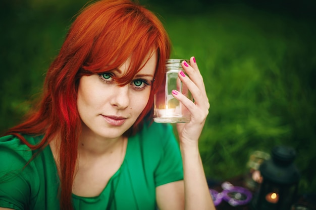 Beautiful red hair girl with deep green eyes