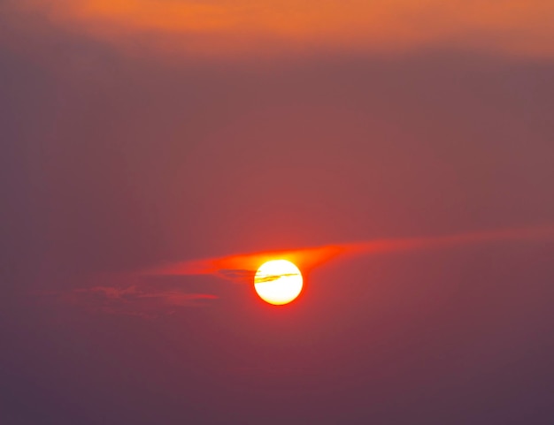 Beautiful red sunset with a disk of the sun in the sky of Greece