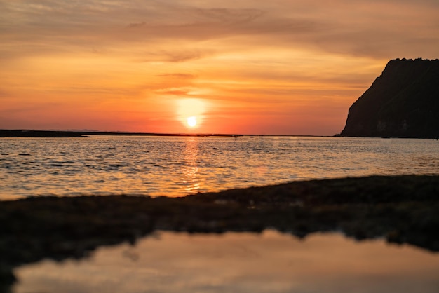 Beautiful red tropical sunrise on the beach