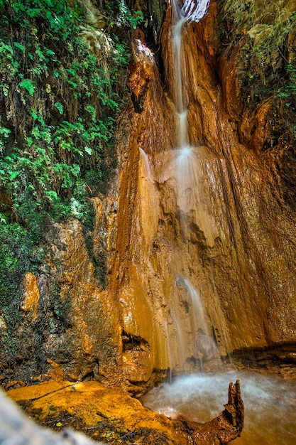 beautiful red waterfall of ferruginous water