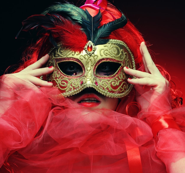 Beautiful redhair woman with mask