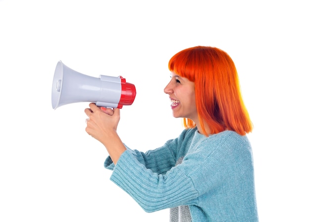 Beautiful redhead woman with a megaphone
