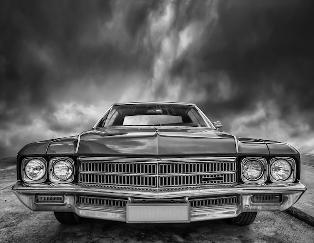 Beautiful retro car stands against a cloudy sky