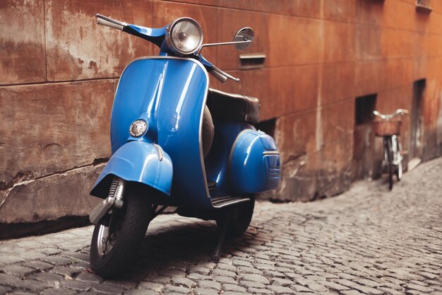 A beautiful retro moped parked on the street of the old town