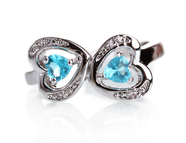 Beautiful ring with blue precious stones isolated on white