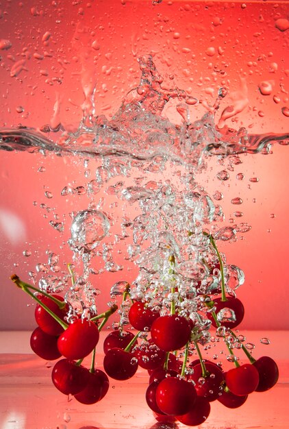 Beautiful ripe berries in water in air bubbles