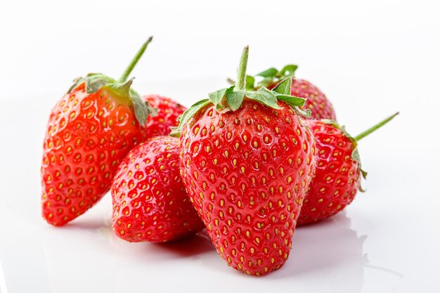 Beautiful and ripe red strawberries on a white background