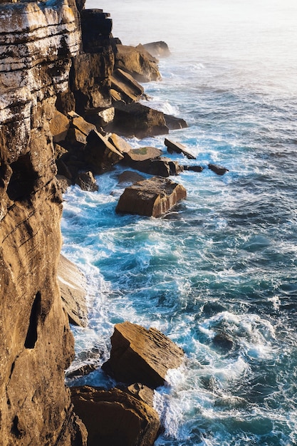 Beautiful rocky coast of the atlantic ocean at sunset