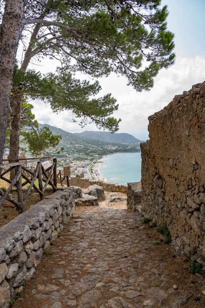 Beautiful rocky path on the mountain leading to the sea Sicily Italy