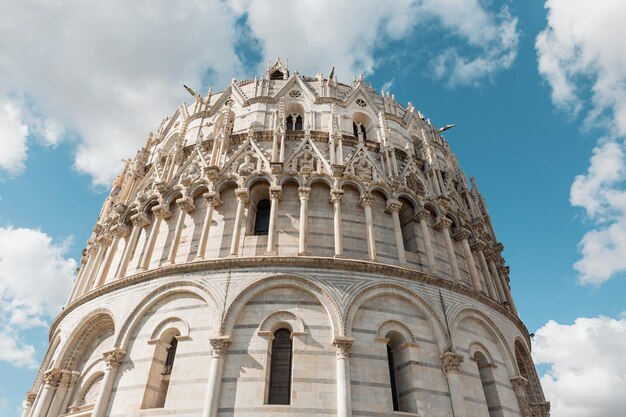 Beautiful romanesque architecture facade of a cathedral in the european city of pisa italy amazing ancient building on a sunny day with clouds